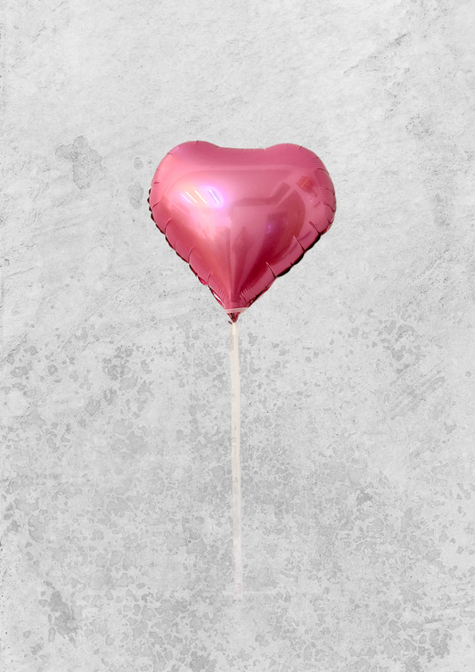 Globo rojo en forma de corazón