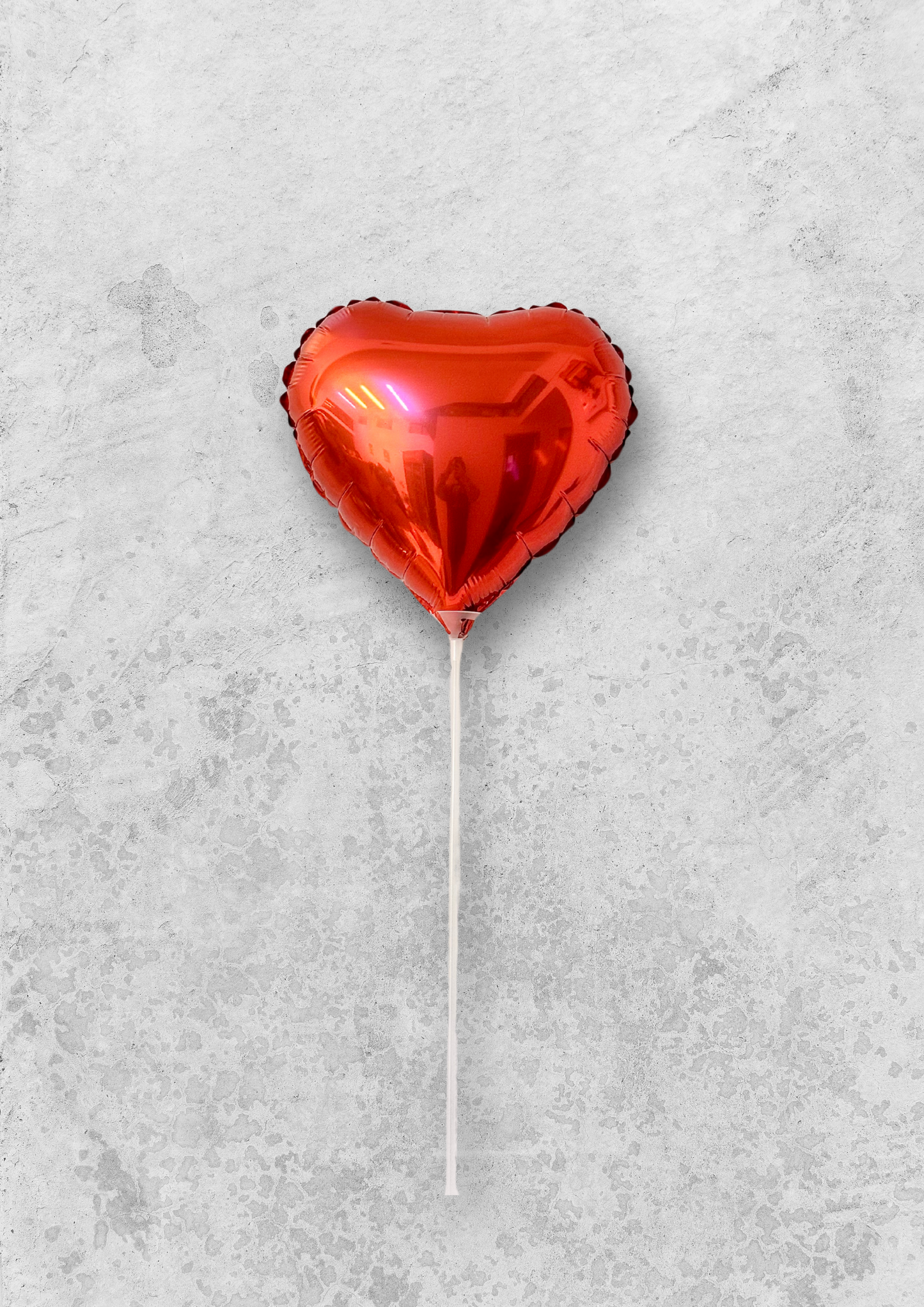 Globo rojo en forma de corazón